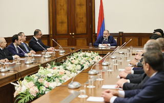 The Prime Minister congratulates Tigran Khachatryan on his appointment to the new position and introduces the newly appointed Minister to the staff of the Ministry of Finance